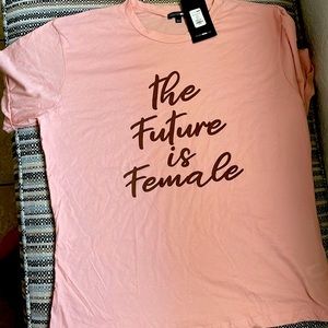 Light pink tee shirt from fashionova with brown writing.